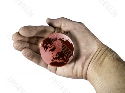 Hand enclosing red globe