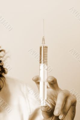 Portrait of a young doctor with syringa.