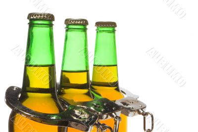 Beer and Handcuffs - Drunk Driving Concept