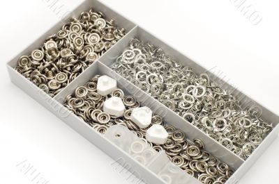 Metal button in box