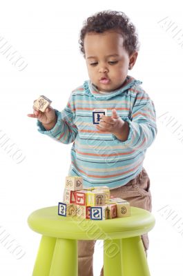 Baby playing with small pieces