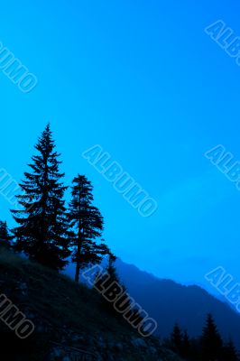 Green hill with blue sky