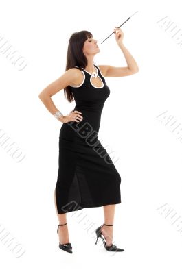 brunette in black dress with cigarette holder