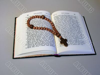 rosary on book