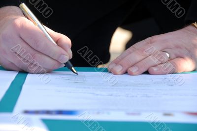 Businessman is signing a contract