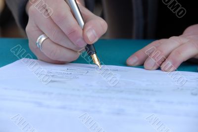 Businessman is signing a contract