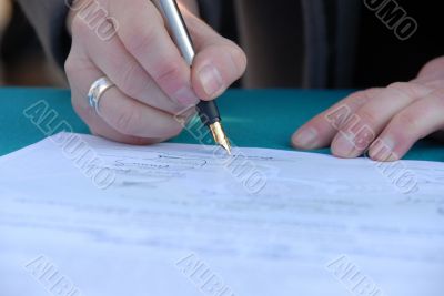 Businessman is signing a contract