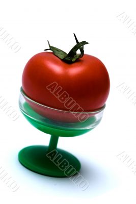 Juicy Isolated Tomato on a green suppot