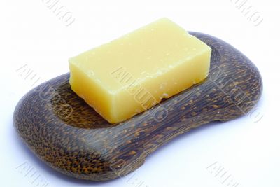 Yellow soap in soapdish