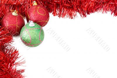 Three Christmas baubles with red tinsel