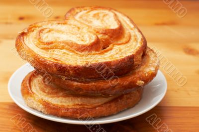 Palmier pastries on white saucer