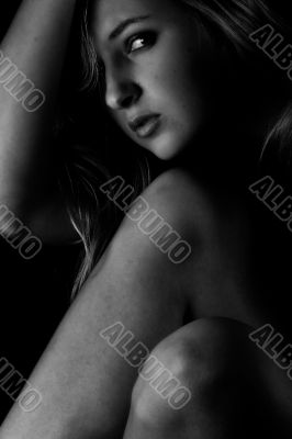 Woman is hiding in the dark