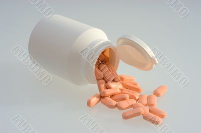 Medicine pills with a white bottle