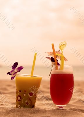 Cocktail couple at sunset