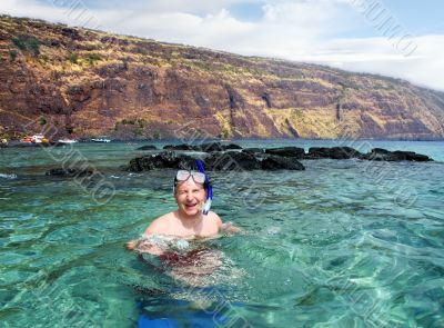 Happy man snorkeling