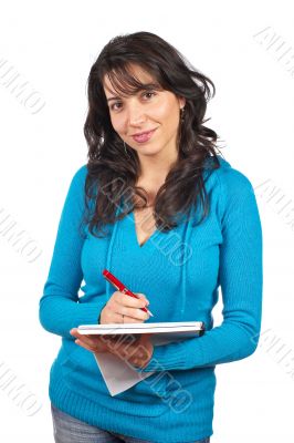 Young student woman writing