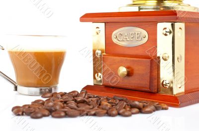 Cup, grinder, coffee pot and beans