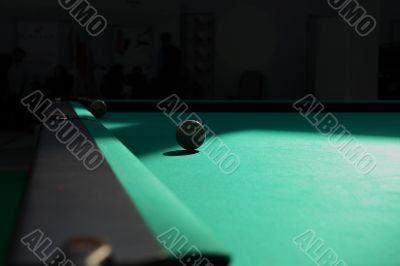 Pool table shined by sun.