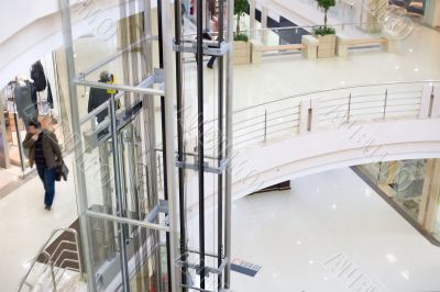 Modern glass elevator in the mall