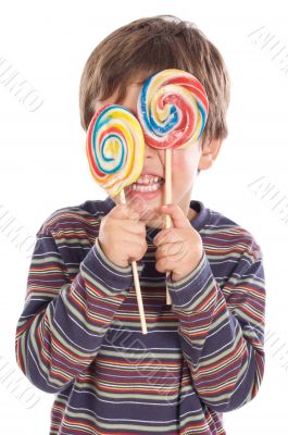 Child eating two lollipops