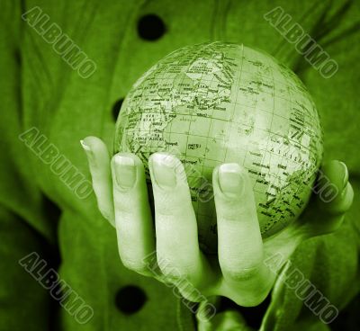 Globe in a girl`s hands