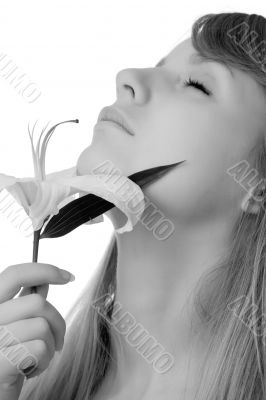 young girl smelling lily