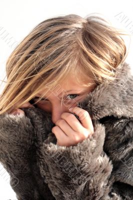 girl in a fur coat in the winter