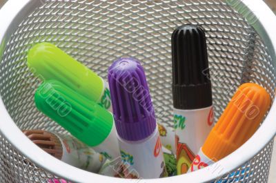 Child`s felt-tip pens-markers in a white tumbler