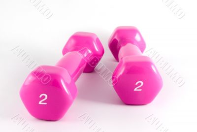 two pink dumbbells