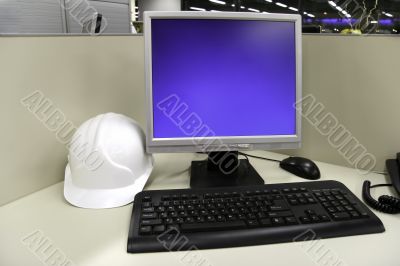 helmet and computer at office