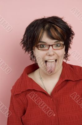 young beaitful woman sticking out tongue