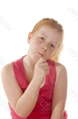 A young child enjoys a lollypop
