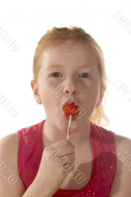 A young child enjoys a lollypop