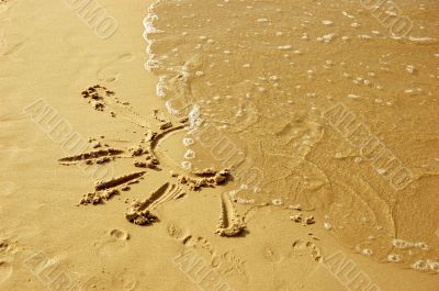 Sun drawing on sand
