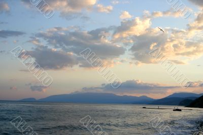 sundown on by sea