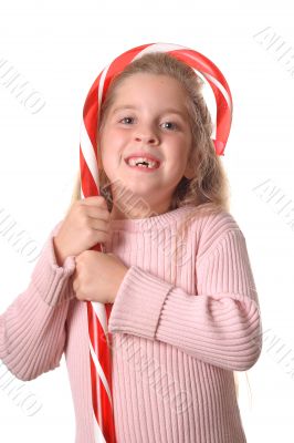 little girl with candy cane vertical