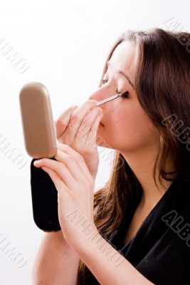 Cosmetic girl is doing her make-up