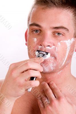 Shaving his face
