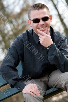 Young man with sunglasses smiling