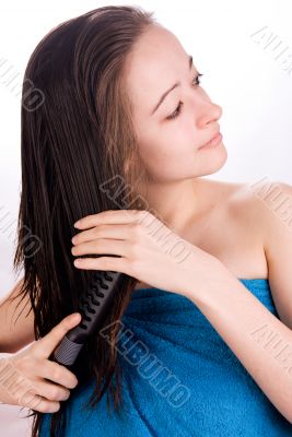 Woman is brushing her hair