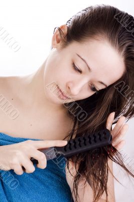 Brushing her hair