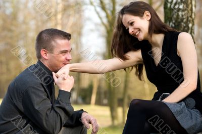 Young man kissing her hand