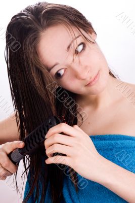 Woman is looking at her hair