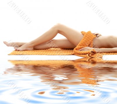 long legs with orange towel on white sand 4