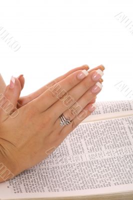 praying hands on bible