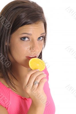 model eating an orange slice