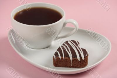 Cup of coffee on pink background