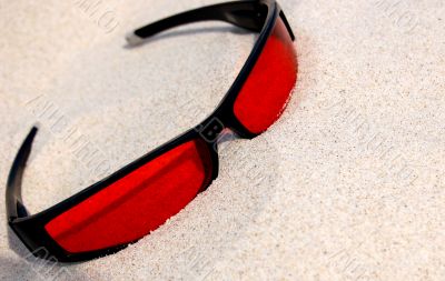 sunglasses on sand