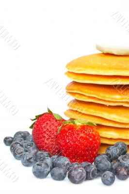 Pancakes, blueberries and strawberries