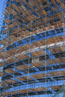 Construction staging on glass facade.